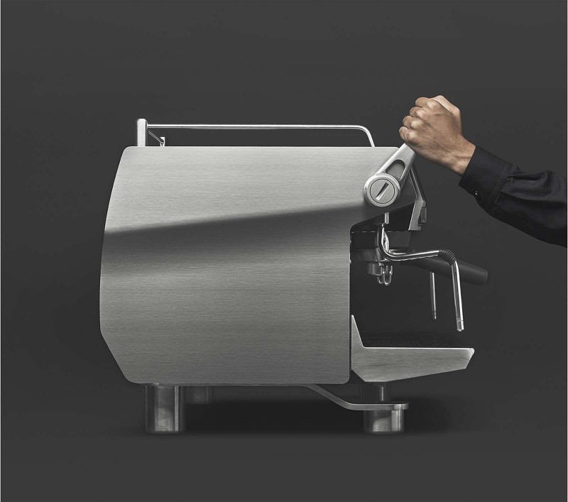 This image is a front-side view of the Rancilio Specialty RS1 2 group espresso machine in Stainless Steel, with adjustable drip tray for varied brew group height and lever for steam actuation.
